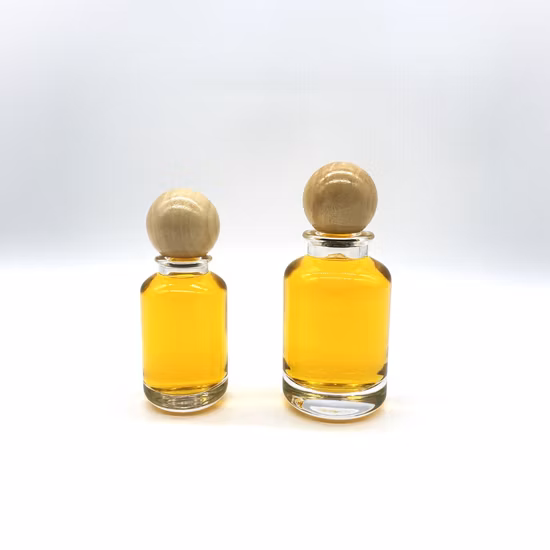 Bouteille de parfum en verre de cylindre de vente chaude de 50ml 100ml avec le chapeau en bois rond